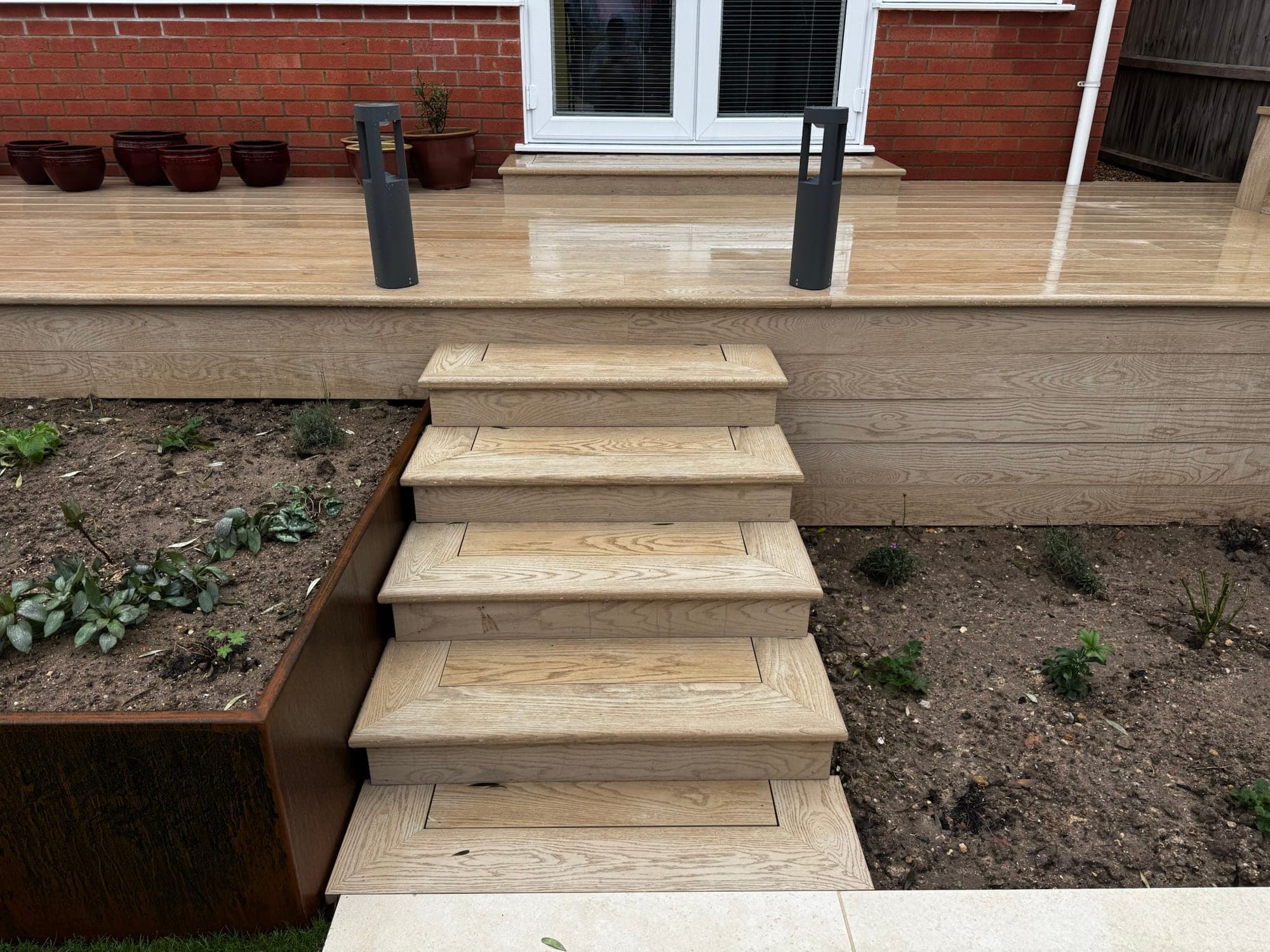 Garden view with decking and hard landscaping
