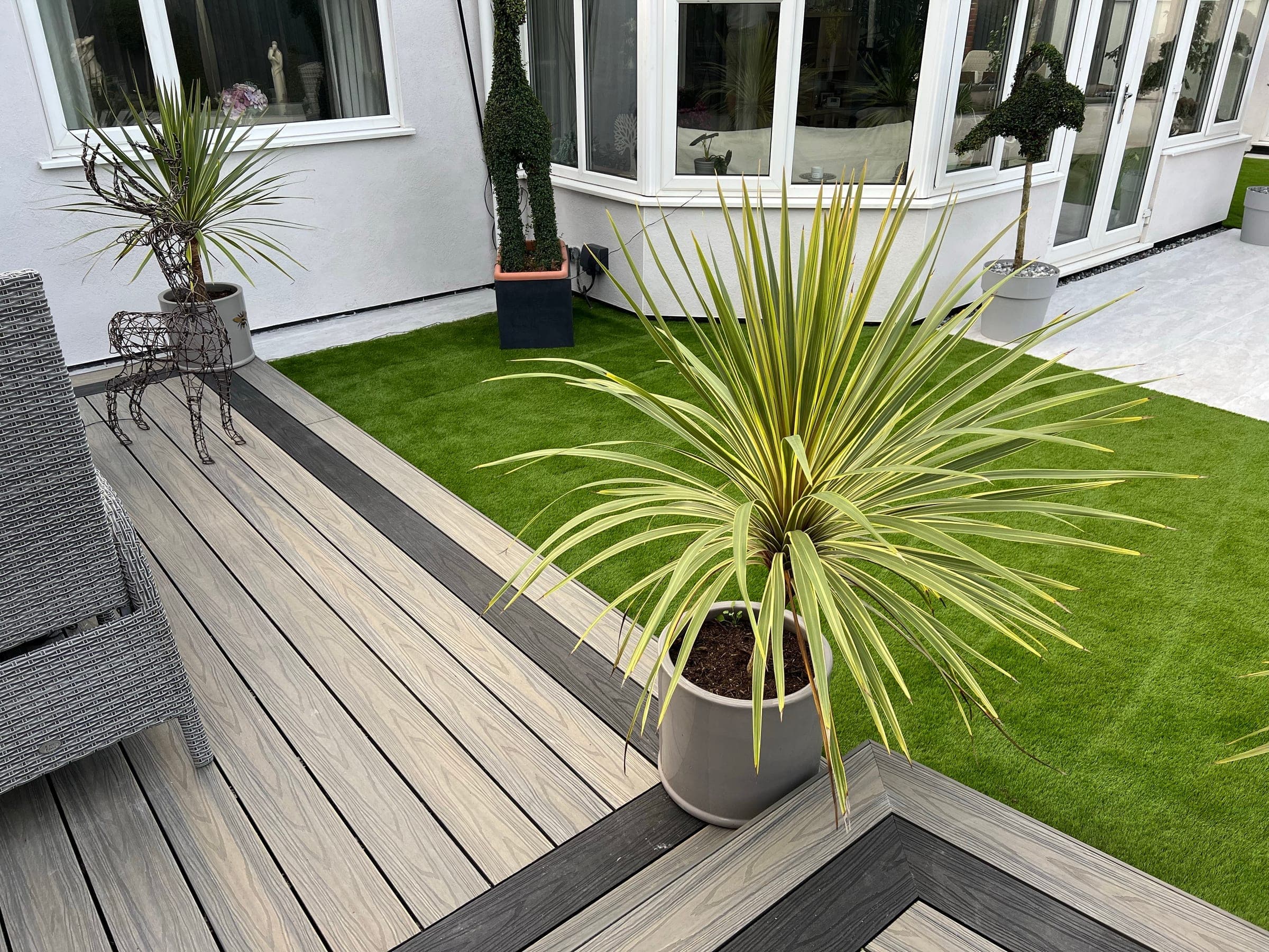 Contemporary garden with decking and lawn