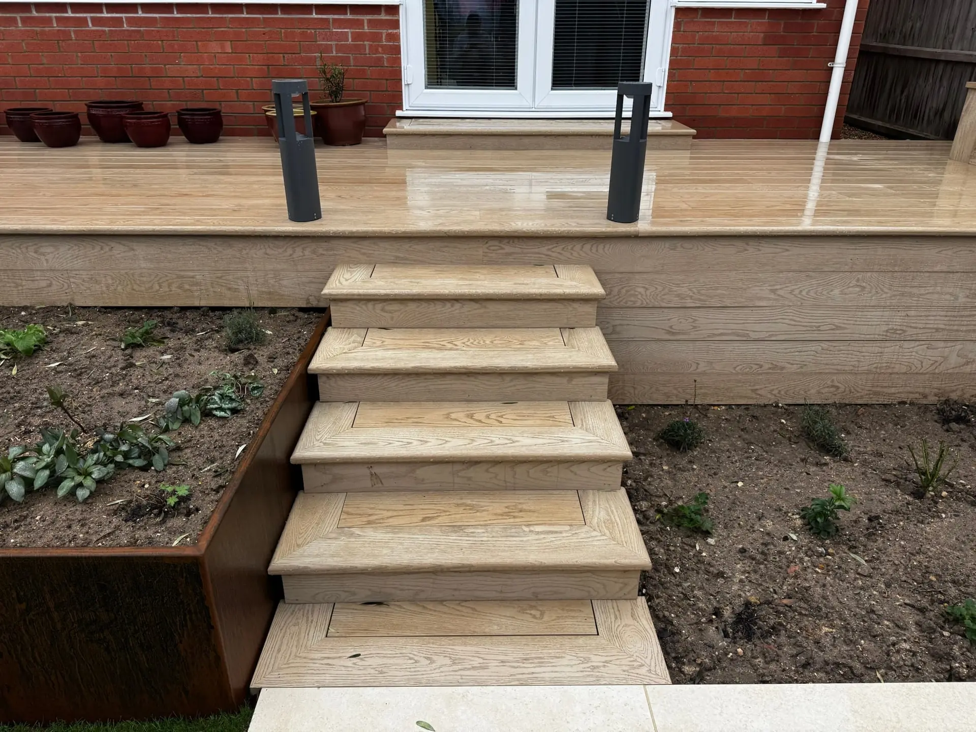 Garden view with decking and hard landscaping