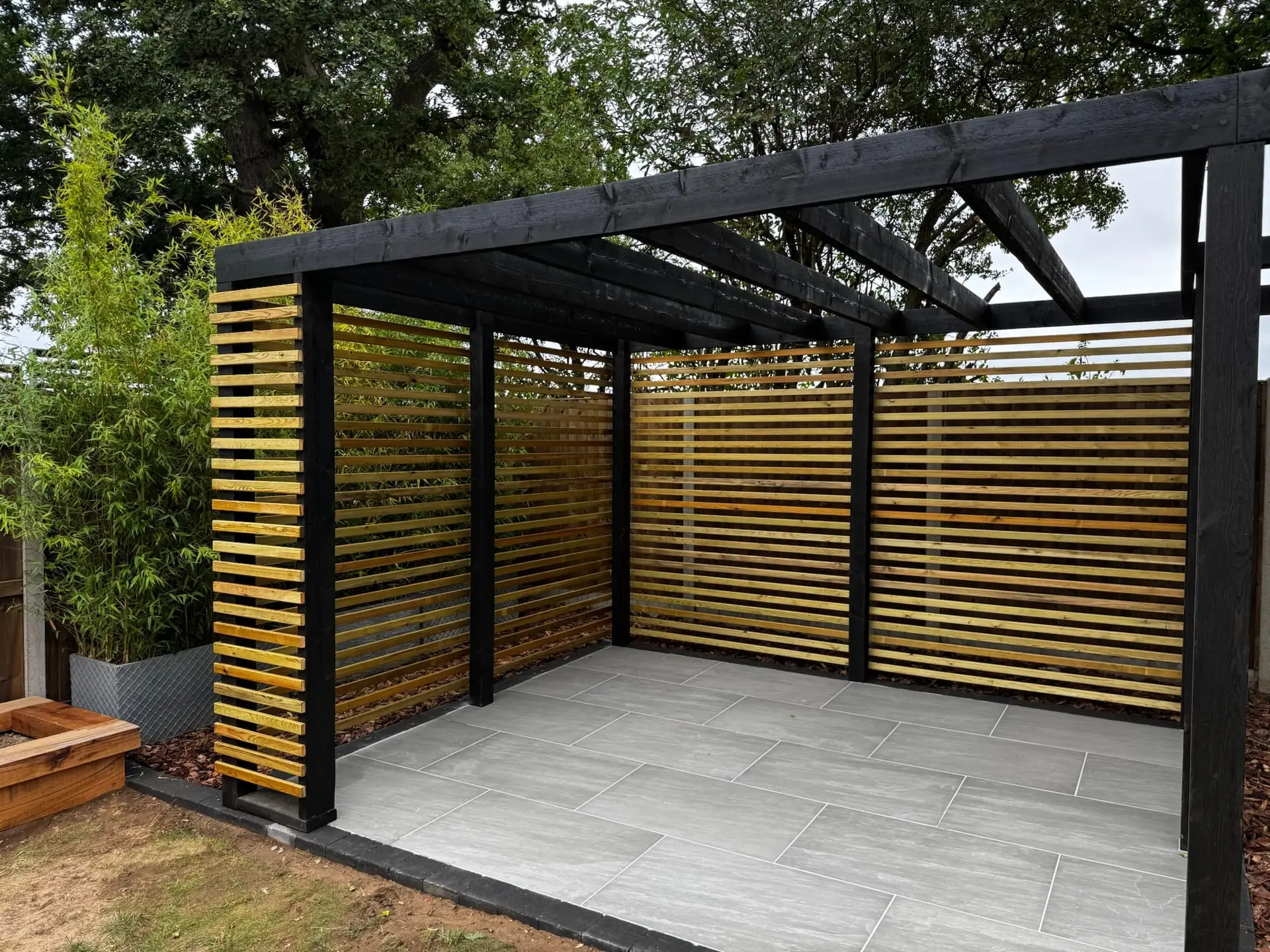 Garden pergola and paved seating area Rackheath